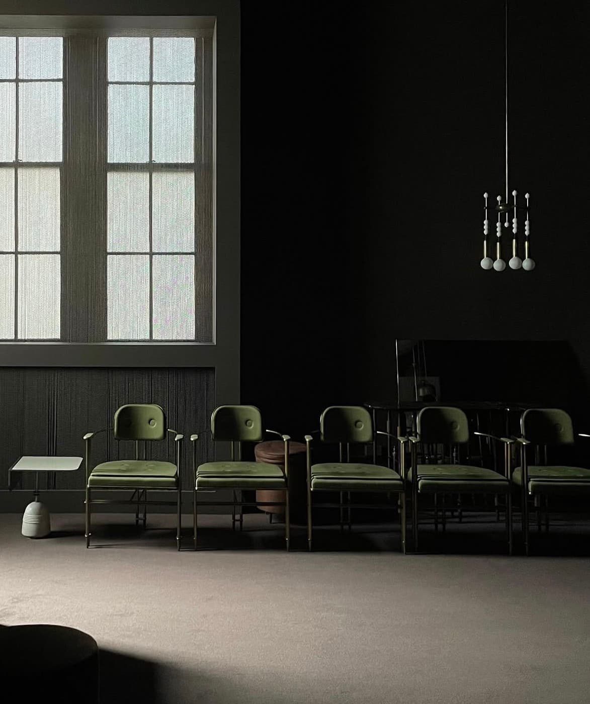 A room designed around a green gaming table